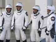 SpaceX Crew5 astronauts, from left, Russian cosmonaut Anna Kikina, NASA astronaut Josh Cassada, NASA astronaut Nicole Mann and Japan Aerospace Exploration Agency astronaut Koichi Wakata pose for a photo as they leave the Operations and Checkout building before heading to Launch Pad 39-A at the Kennedy Space Center in Cape Canaveral, Fla., for a mission to the International Space Station Wednesday, Oct. 5, 2022.