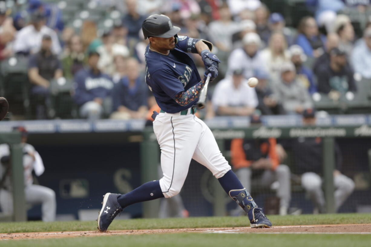 Seattle Mariners' Julio Rodriguez hits a solo home run on a pitch from Detroit Tigers starting pitcher Tyler Alexander during the first inning of a baseball game, Wednesday, Oct. 5, 2022, in Seattle.