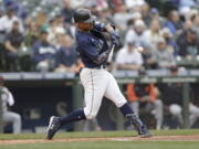 Seattle Mariners' Julio Rodriguez hits a solo home run on a pitch from Detroit Tigers starting pitcher Tyler Alexander during the first inning of a baseball game, Wednesday, Oct. 5, 2022, in Seattle.