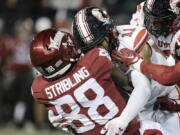 Utah safety R.J. Hubert (11) tackles Washington State wide receiver De'Zhaun Stribling (88) during the first half of an NCAA college football game, Thursday, Oct. 27, 2022, in Pullman, Wash.