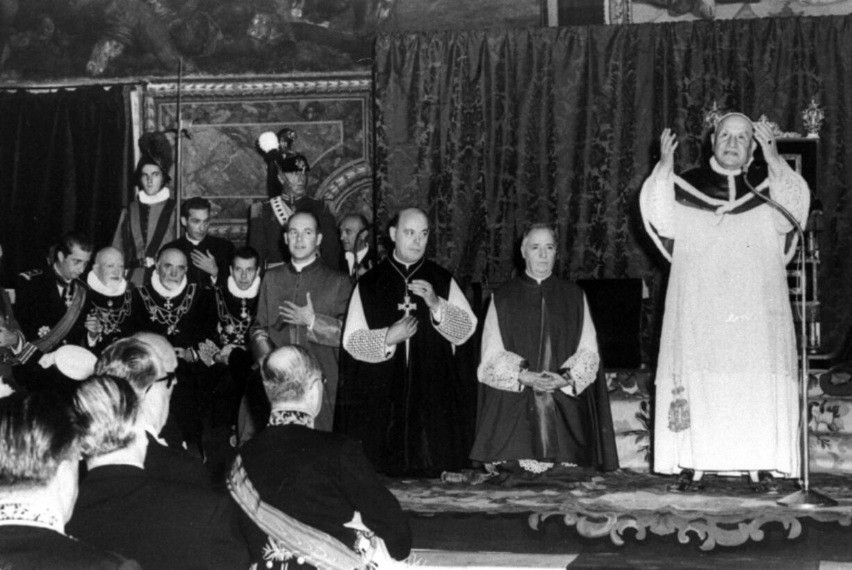 FILE - Pope John XXIII stands and prays in the Sistine Chapel in Vatican City, Oct. 12, 1962, during a special audience to delegates from foreign governments to the ecumenical council. Pope Francis commemorates the 60th anniversary of the opening of the Second Vatican Council by celebrating a Mass in honor of St. John XXIII, the "good pope" who convened the landmark meetings that modernized the Catholic Church.