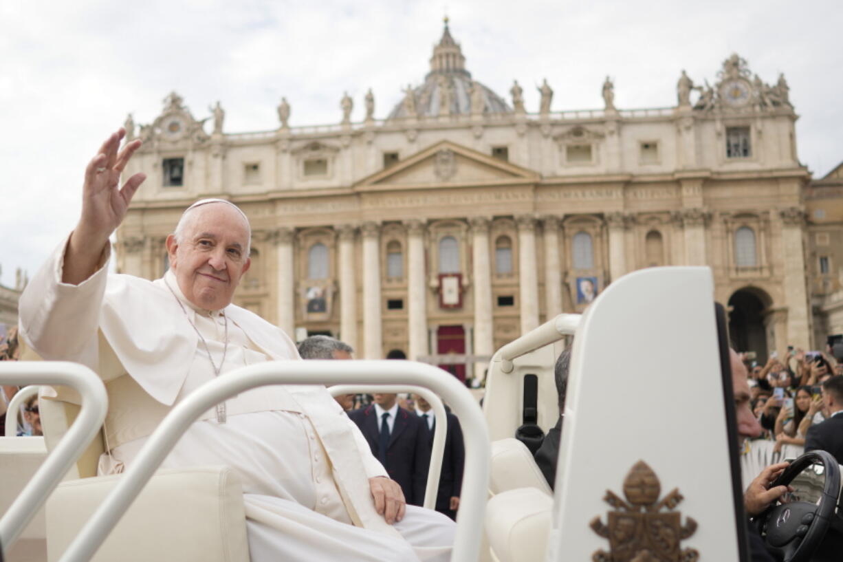 Pope Francis delivers his blessing as he leaves St. Peter's square at the Vatican after celebrating a mass for the canonization of two new saints, Giovanni Battista Scalabrini and Artemide Zatti, Sunday, Oct. 9, 2022.