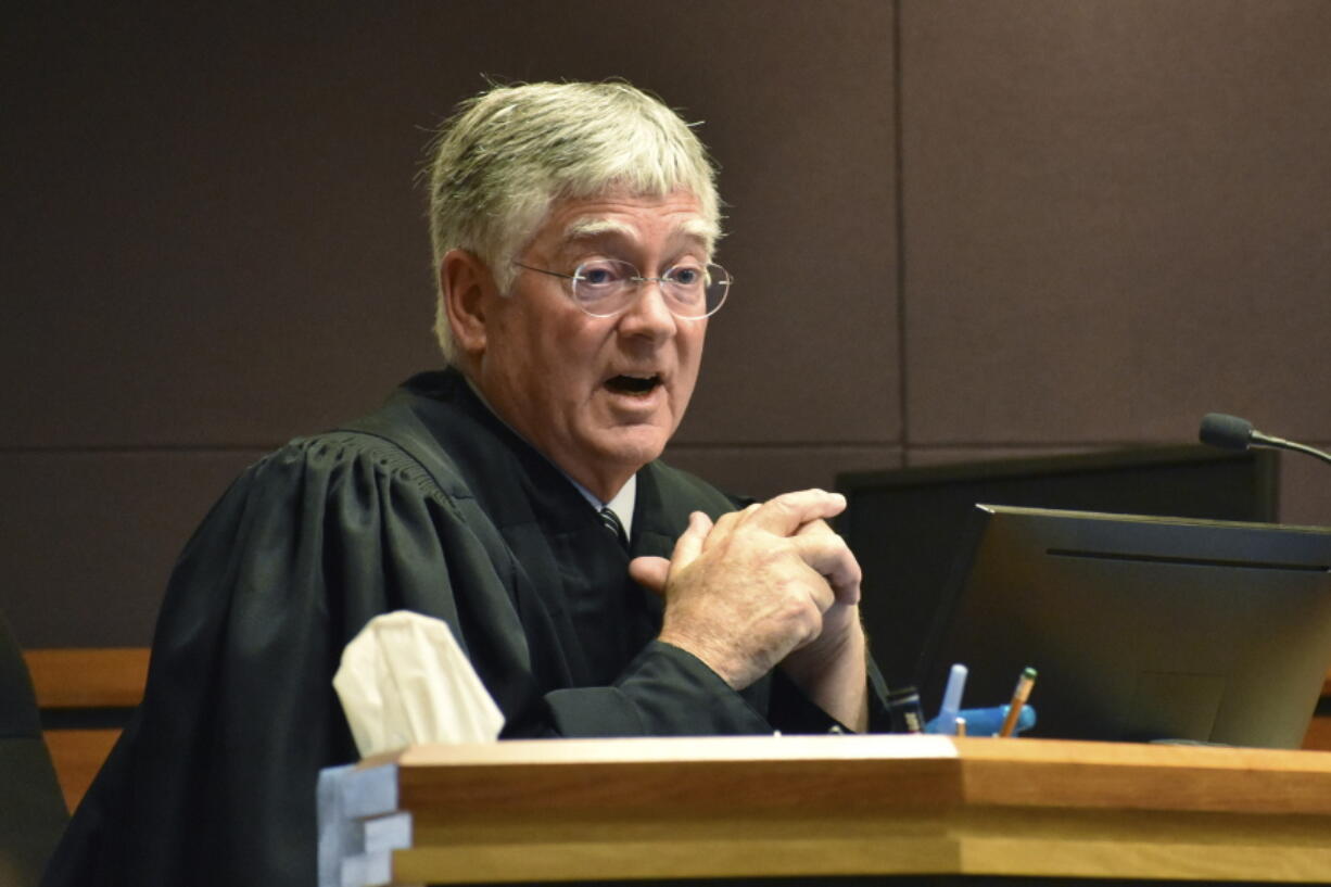 FILE - Montana District Judge Michael Moses speaks to attorneys during a court hearing on Sept 15, 2022, in Billings, Mont. The judge has struck down state laws that ended same-day voter registration, tightened student identification requirements for elections and restricted third-party ballot collections.