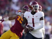 Washington State quarterback Cameron Ward (1) prepares to throw during the first half of an NCAA college football game against Southern California, Saturday, Oct. 8, 2022, in Los Angeles.