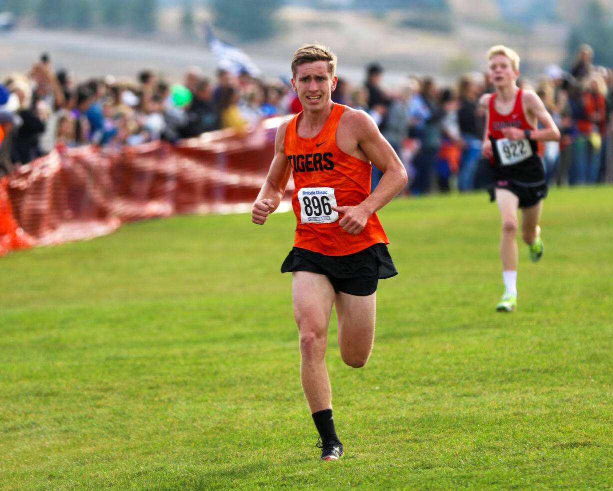 Battle Ground senior Todd Copper runs at the 4A boys race at the Westside Classic bi-district cross country meet in University Place on Oct.