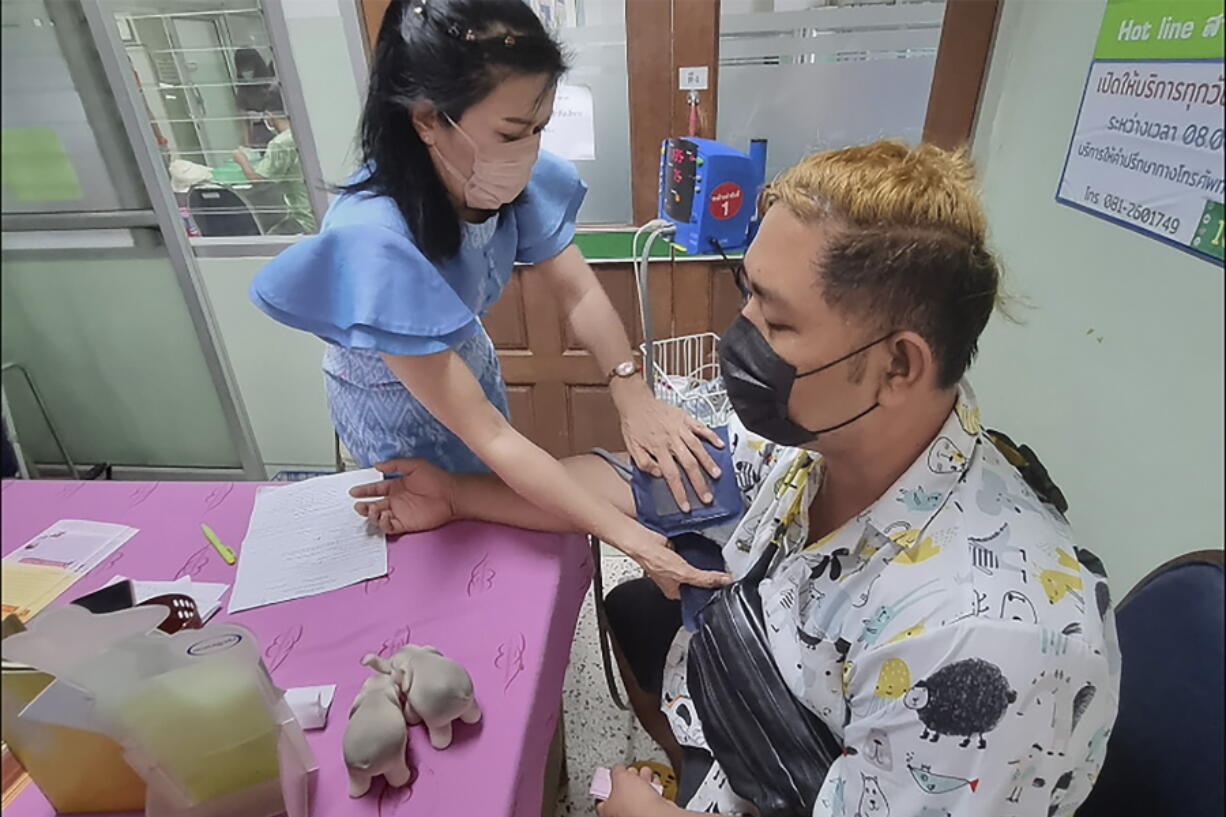 A resident donates blood a the local hospital for victims of an attack at a daycare center, Thursday, Oct. 6, 2022, in the town of Nongbua Lamphu, north eastern Thailand. More than 30 people, primarily children, were killed Thursday when a gunman opened fire in the childcare center authorities said.