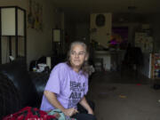 Saree Adams, a tenant at Rockwood Terrace in Washougal, sits in her two-bedroom apartment where she has lived for 10 years. The complex recently raised rents by nearly $400 for some residents, an increase of about 40 percent. Adams and many other residents say they cannot pay the new price.