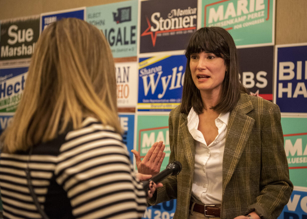 Democratic nominee for Washington’s Third Congressional District Marie Gluesenkamp Perez talks to TV news crews on Tuesday, Nov. 8, 2022, at the Clark County Democrats election night watch party at the Downtown Vancouver Hilton.