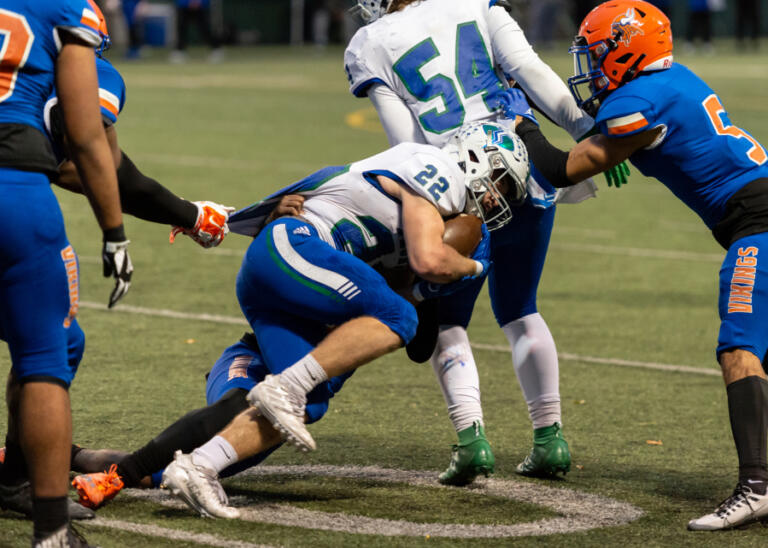 Mountain View's Porter Drake fights for extra yards in a district playoff game on Saturday, Nov. 5, at Seattle Memorial Stadium.