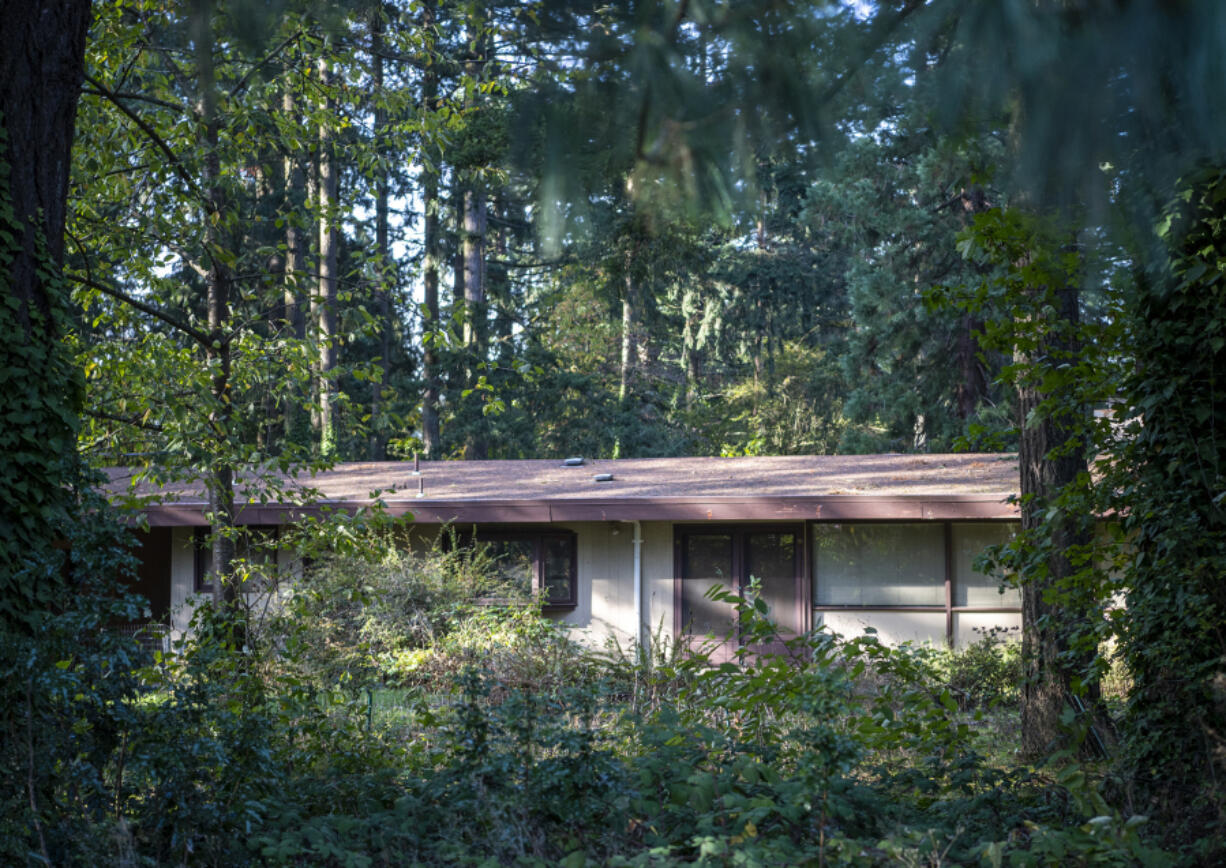 Trees and a house sit on the future site of a 26-unit, townhome-style development Thursday on Northeast 117th Avenue.