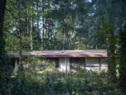 Trees and a house sit on the future site of a 26-unit, townhome-style development Thursday on Northeast 117th Avenue.