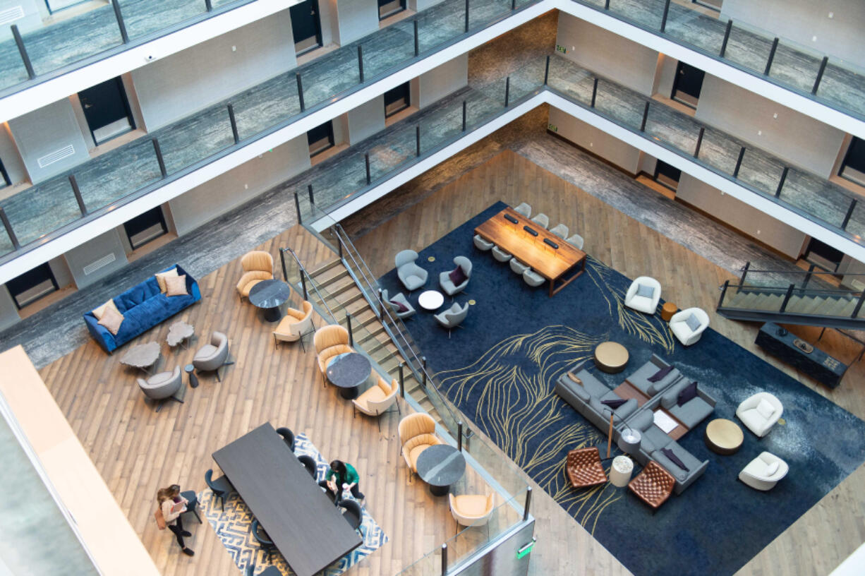A large, open atrium greets guests upon their arrival at Hotel Indigo, which has opened for business.