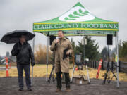 Clark County Food Bank President Alan Hamilton, center, and Board Chair Elson Strahan, left, stand and deliver speeches during a groundbreaking ceremony for the Clark County Food Bank's new Vision Center.