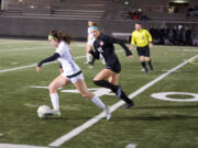 Camas forward Saige McCusker (22) chases Eastlake's Sophia Bonacci during a Class 4A first round state playoff soccer match on Tuesday, Nov. 8, 2022, at Doc Harris Stadium.