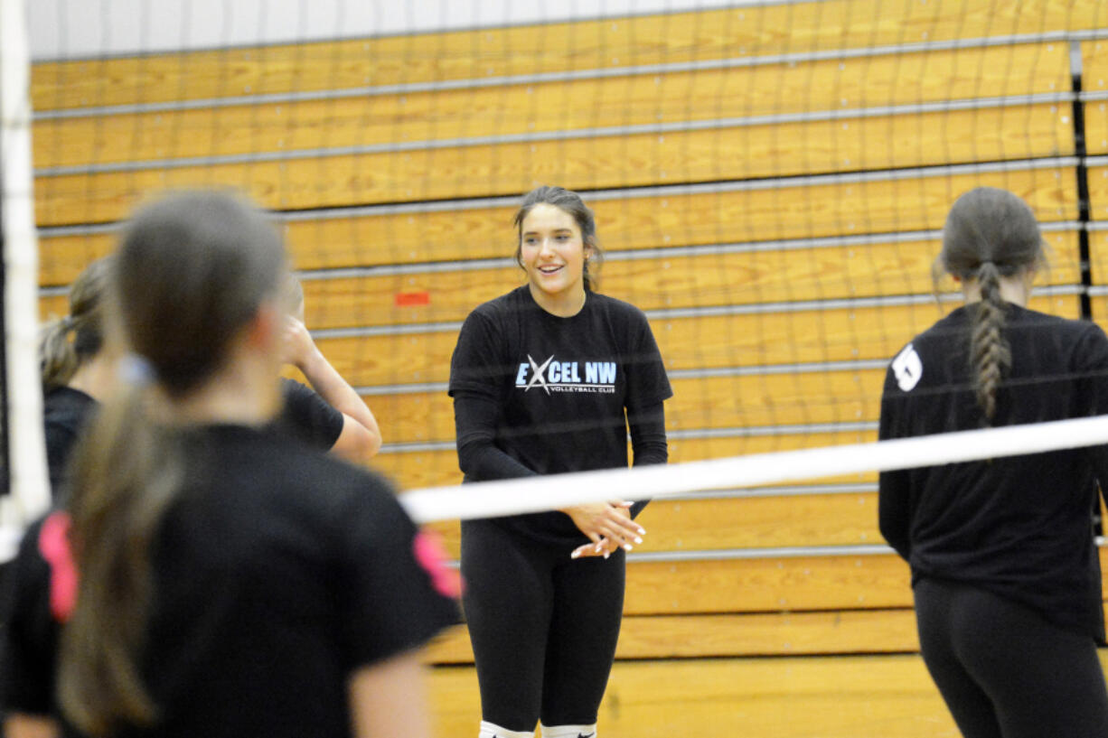 Elle Schoene chats with a teammate during a practice at La Center High School. Schoene and the La Center volleyball team have high goals heading into the Class 1A state volleyball tournament.