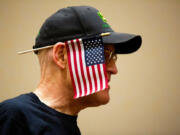 An attendee wears an American flag on his ear at the Washington State Republicans election night watch party Tuesday in Bellevue.