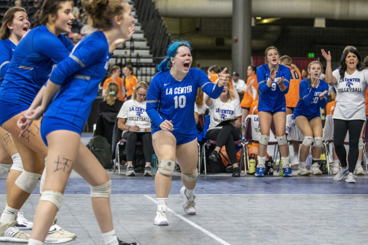 La Center's Grace Clinton (10) yells in celebration as the Wildcats score against Lakeside of Nine Mile Falls in the consolation bracket of the 1A state volleyball tournament in Yakima on Saturday, Nov. 12, 2022.