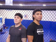 Professional mixed martial arts fighters Ricky Simon, left, and John Simon pose at American Top Team in Portland. John Simon will headline an MMA event at the Clark County Fairgrounds on Nov. 19 with his cousin, UFC rising star Ricky Simon, in his corner.