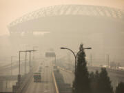 Lumen Field is hidden in smoke as seen from the Dr. Jose P Rizal Bridge on Thursday, Oct. 20, 2022.