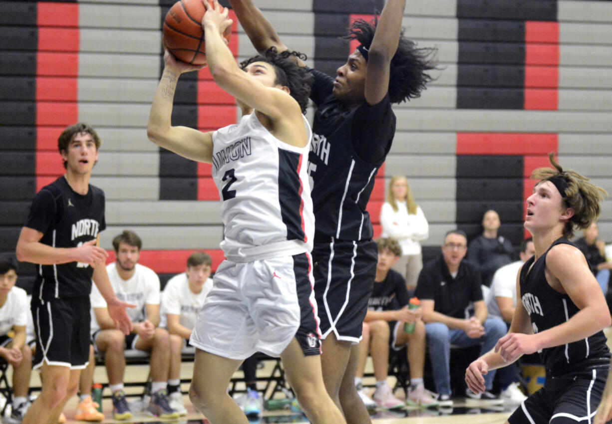 Union's Jayden Cardiel (2) looks to get a shot up past North Kitsap defender Jay Ashford-Downing (15) in the Titans' season opener on Saturday, Nov. 26, 2022, at Union High School.