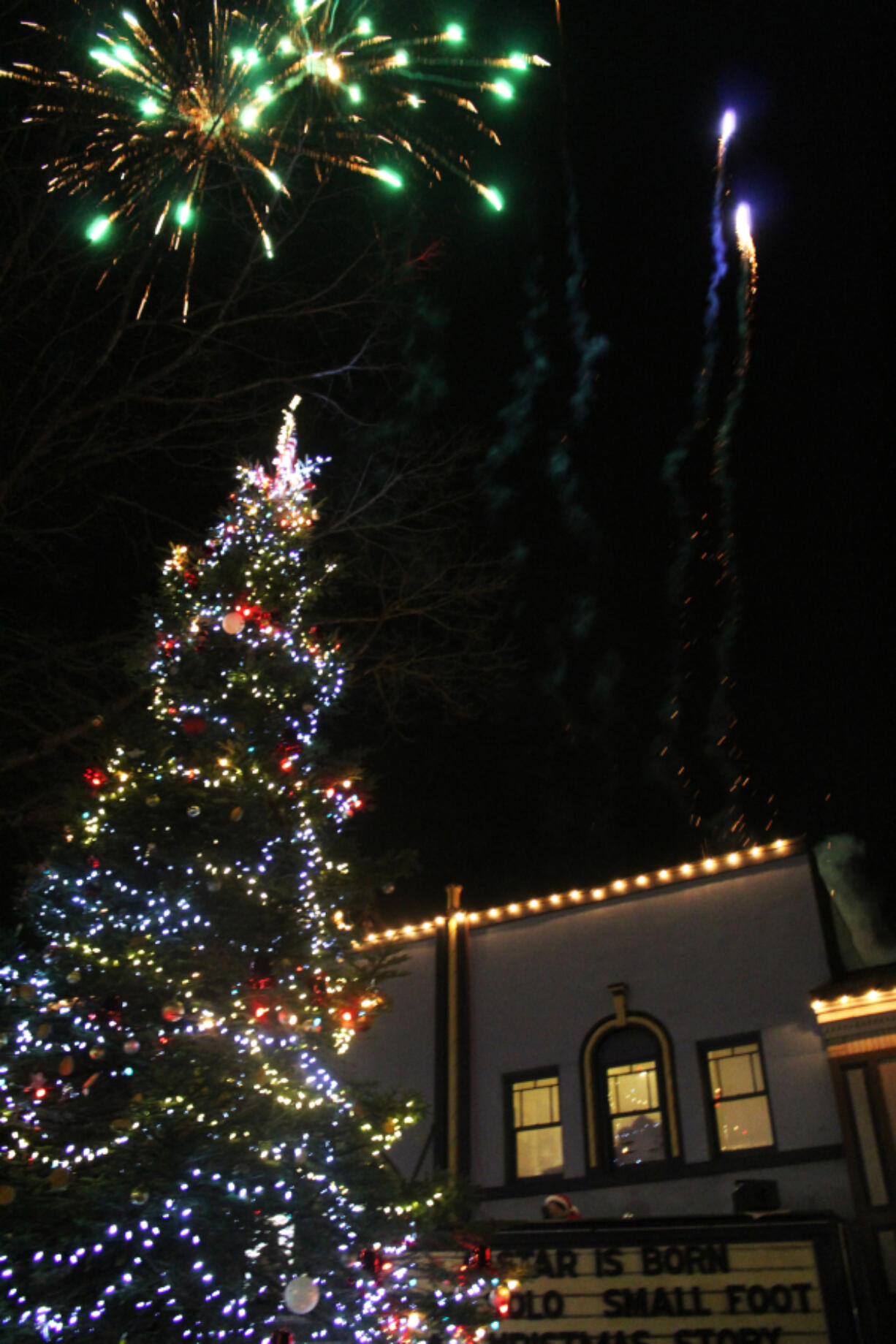 Fireworks light the sky above the just-lit Christmas tree in downtown Camas at the 2018 Hometown Holidays event.