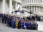 Newly-elected members of Congress pose for a class photo on the East Front of the Capitol in Washington, Tuesday, Nov. 15, 2022.