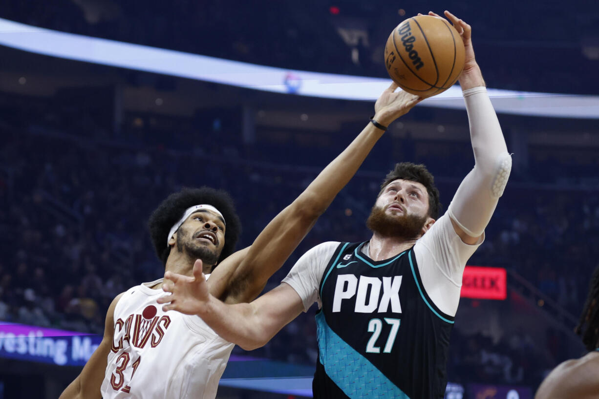 Portland Trail Blazers center Jusuf Nurkic (27) grabs a rebound against Cleveland Cavaliers center Jarrett Allen (31) during the first half of an NBA basketball game, Wednesday, Nov. 23, 2022, in Cleveland.