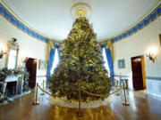 The White House Christmas Tree is on display in the Blue Room of the White House during a press preview of holiday decorations at the White House, Monday, Nov. 28, 2022, in Washington.