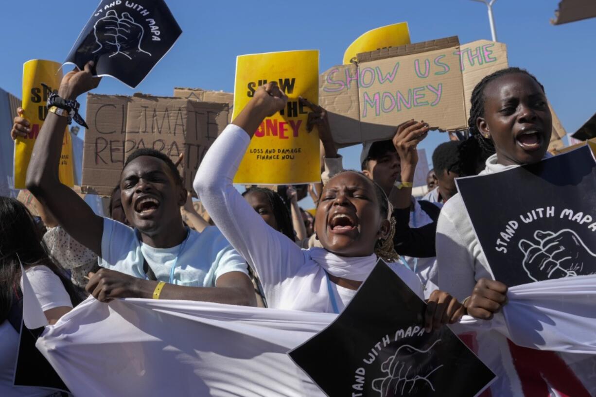 Demonstrators participate in a Fridays for Future protest calling for money for climate action at the COP27 U.N. Climate Summit, Friday, Nov. 11, 2022, in Sharm el-Sheikh, Egypt.