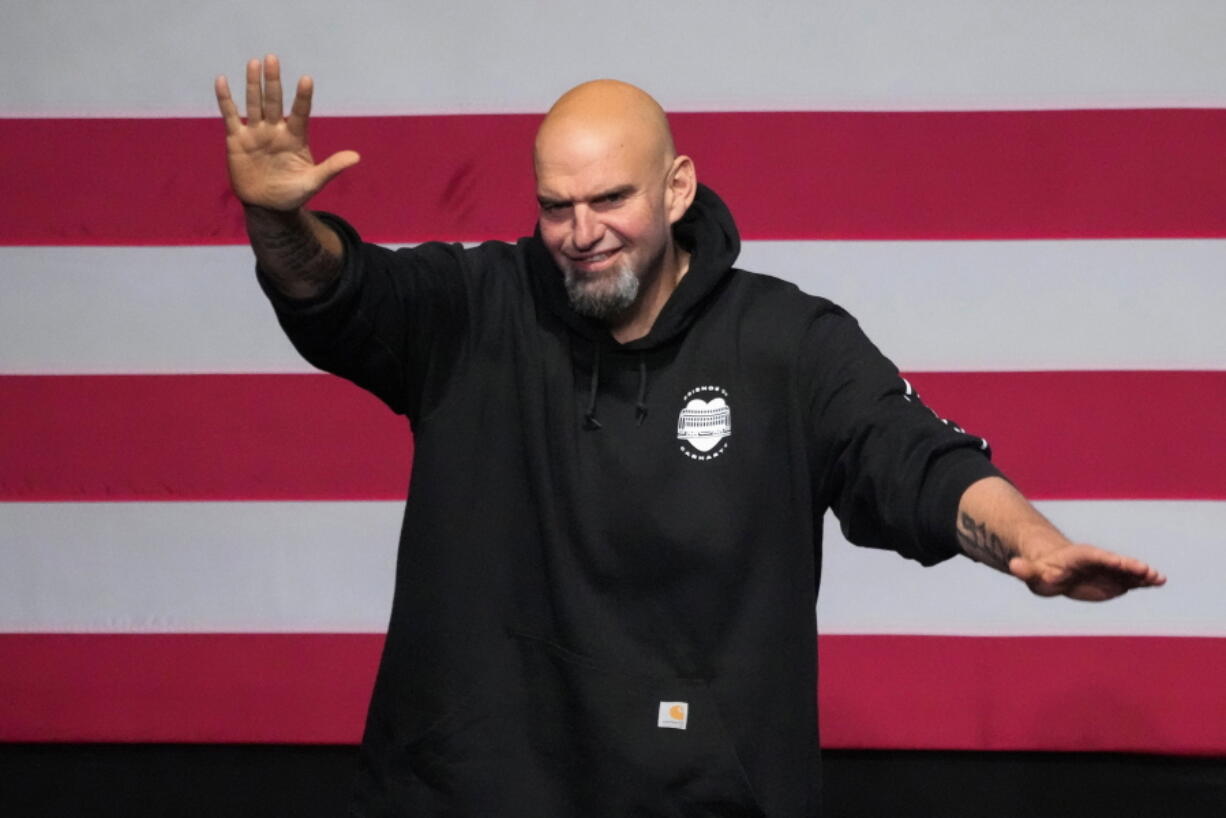 Pennsylvania Lt. Gov. John Fetterman, Democratic candidate for U.S. Senate from Pennsylvania, waves to supporters after addressing an election night party in Pittsburgh, Wednesday, Nov. 9, 2022. (AP Photo/Gene J.