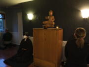 Resident priest Genmyo Jana Zeedyk, second from left, and other members of the Anchorage Zen Community meditate during a Sunday service Oct. 9 in Anchorage, Alaska. (Jae C.