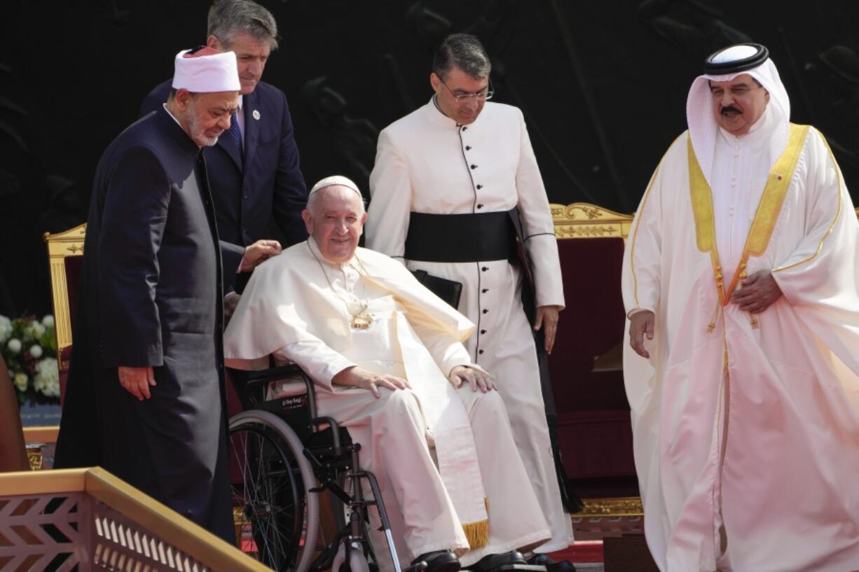 From left, Ahmed El-Tayeb, Grand Imam of al-Azhar, Pope Francis and Bahrain's King Hamad bin Isa Al Khalifa attend the closing session of the "Bahrain Forum for Dialogue: East and west for Human Coexistence", at the Al-Fida square at the Sakhir Royal palace, Bahrain, Friday, Nov. 4, 2022. Pope Francis is making the November 3-6 visit to participate in a government-sponsored conference on East-West dialogue and to minister to Bahrain's tiny Catholic community, part of his effort to pursue dialogue with the Muslim world.