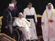 From left, Ahmed El-Tayeb, Grand Imam of al-Azhar, Pope Francis and Bahrain's King Hamad bin Isa Al Khalifa attend the closing session of the "Bahrain Forum for Dialogue: East and west for Human Coexistence", at the Al-Fida square at the Sakhir Royal palace, Bahrain, Friday, Nov. 4, 2022. Pope Francis is making the November 3-6 visit to participate in a government-sponsored conference on East-West dialogue and to minister to Bahrain's tiny Catholic community, part of his effort to pursue dialogue with the Muslim world.