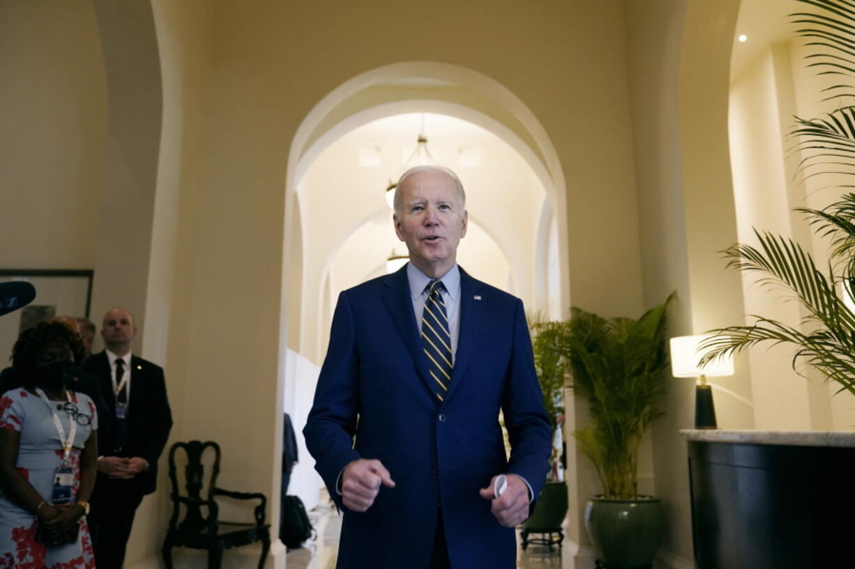 President Joe Biden smiles as he speaks about democratic control of the Senate before leaving his hotel to attend the Association of Southeast Asian Nations (ASEAN) summit, Sunday, Nov. 13, 2022, in Phnom Penh, Cambodia.