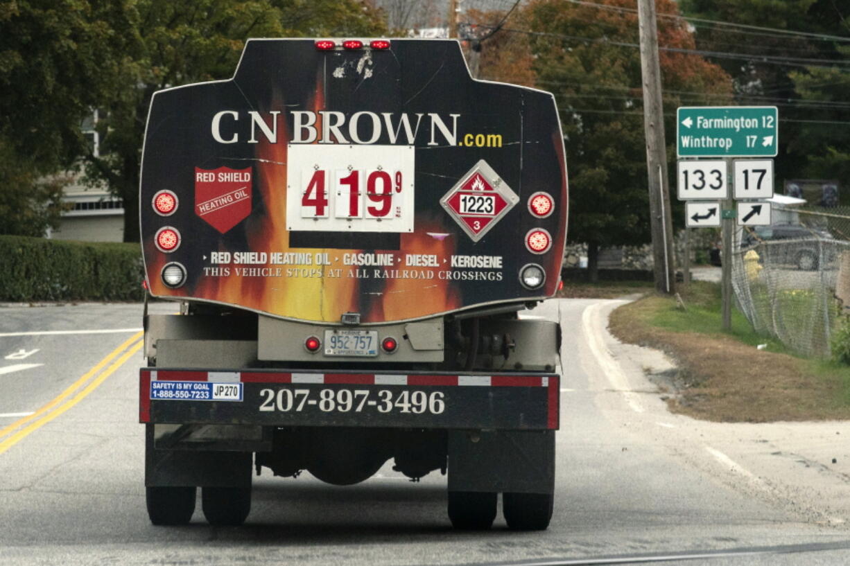 FILE - A fuel delivery truck advertises its price for a gallon of heating oil, Oct. 5, 2022 in Livermore Falls, Maine.  The Biden administration said Wednesday it would make $4.5 billion available to help lower heating costs this winter through a low-income home energy assistance program. The funds will go to heating and utility bill costs, and will also be available to help families make home energy repairs aimed at lowering costs, the White House said. (AP Photo/Robert F.