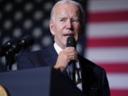 FILE - President Joe Biden speaks about student loan debt relief at Delaware State University, Oct. 21, 2022, in Dover, Del. Biden is facing mounting pressure to extend a pause on student loan payments after his cancellation plan suffered a pair of legal blows. Advocates say Biden should continue the pandemic-era payment pause until legal issues are resolved.