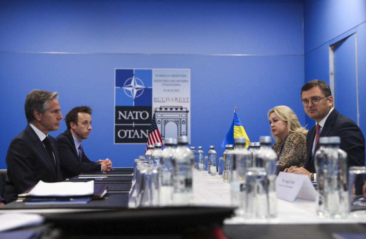 U.S. Secretary of State Antony Blinken meets with Ukraine's Foreign Minister Dmytro Kuleba during the NATO foreign ministers meeting in Bucharest, Romania, Wednesday, Nov. 30, 2022.