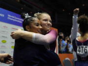 Jordan Chiles of the U.S., left, and compatriot Jade Carey celebrate after competing in the vault finals during the Artistic Gymnastics World Championships at M&S Bank Arena in Liverpool, England, Saturday, Nov. 5, 2022.