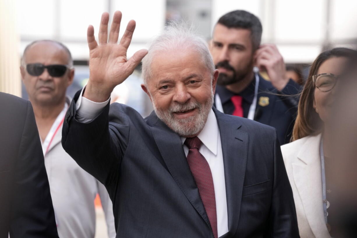Brazilian President-elect Luiz Inacio Lula da Silva waves as he arrives at the COP27 U.N. Climate Summit, Wednesday, Nov. 16, 2022, in Sharm el-Sheikh, Egypt.