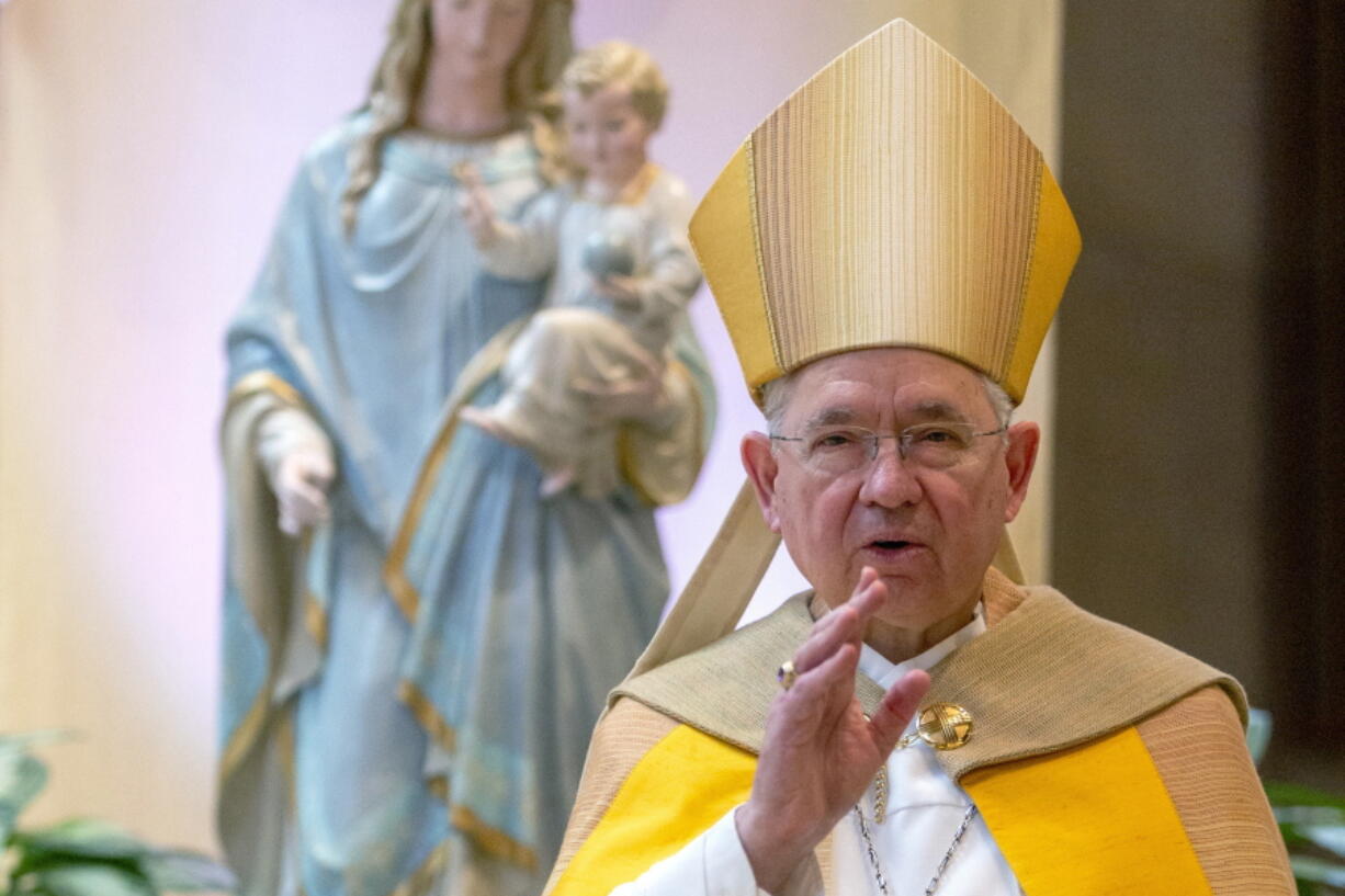 FILE - In this Friday, May 1, 2020 file photo, Archbishop Jose H. Gomez gives a blessing after leading a brief liturgy at the Cathedral of Our Lady of the Angels in Los Angeles. The nation's Catholic bishops begin their fall annual meeting Monday, Nov. 14, 2022, where they plan to elect new leaders -- a vote that may signal whether they want to be more closely aligned with Pope Francis' agenda or maintain a more formal distance.