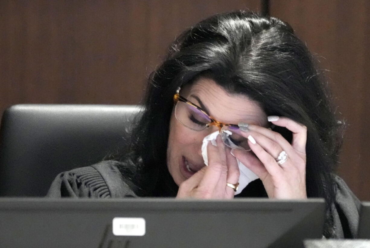 Waukesha County Circuit Court Judge Jennifer Dorow wipes away tears while talking about victim statements during her closing remarks before sentencing Darrell Brooks to 6 consecutive life sentences in a Waukesha County Circuit Court in Waukesha, Wis., on Wednesday, Nov. 16, 2022.