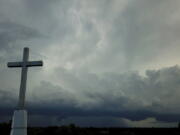 Storm clouds approach a church Aug. 2, 2020, in Mequon, Wis. A new Pew Research Center report published Thursday explores how religion in the U.S. intersects with views on the environment and climate change.