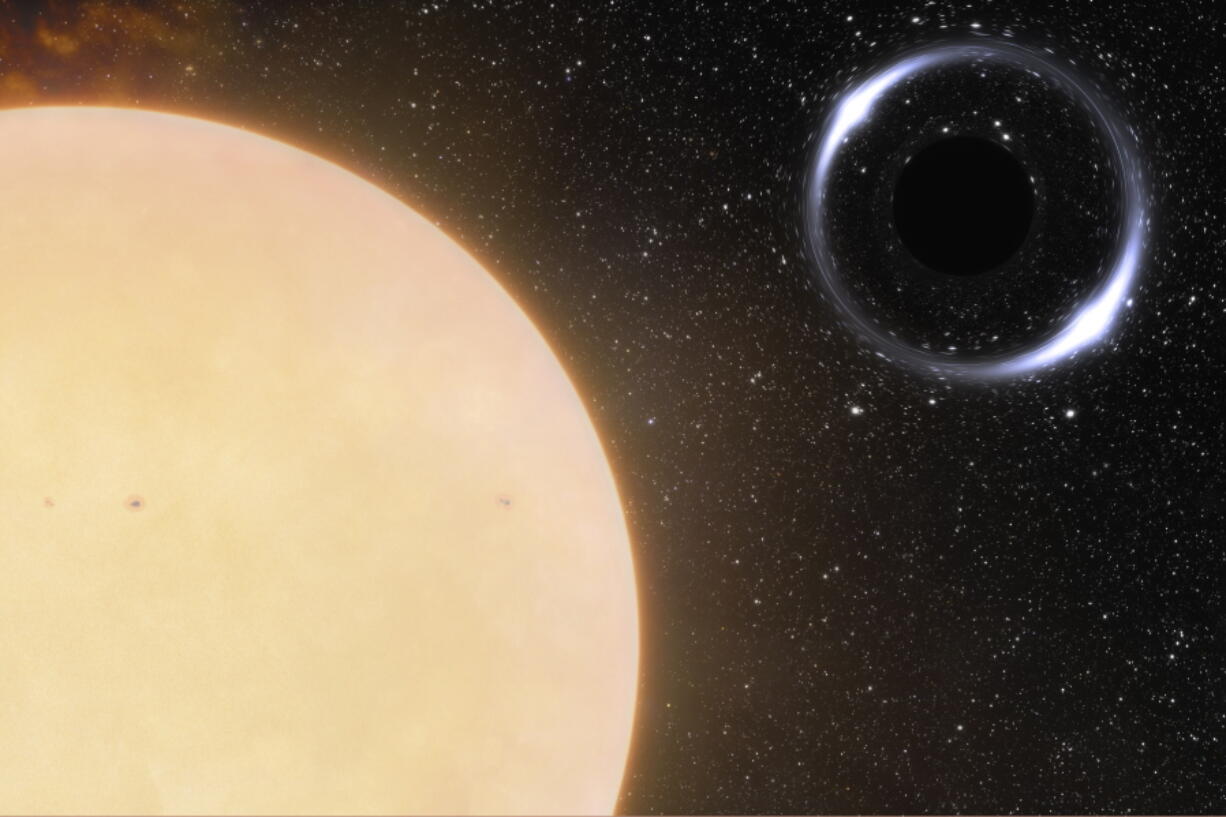 This illustration provided by NOIRLab in November 2022 depicts the closest black hole to Earth and its Sun-like companion star. The binary system, about 1,600 light years from Earth, was initially identified using the European Space Agency's Gaia spacecraft. Astronomers followed up with the International Gemini Observatory in Hawaii to confirm their findings. (International Gemini Observatory/NOIRLab/NSF/AURA/J. da Silva/Spaceengine/M.