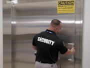 A security guard opens a steel door leading into a vault containing hundreds of collectibles at Collectors Vault, a new company that is making it easier for collectors to store and trade memorabilia, on Oct. 21, 2022, in Delaware. The door is nearly two feet thick and is meant to protect the valuables from harm and thieves.