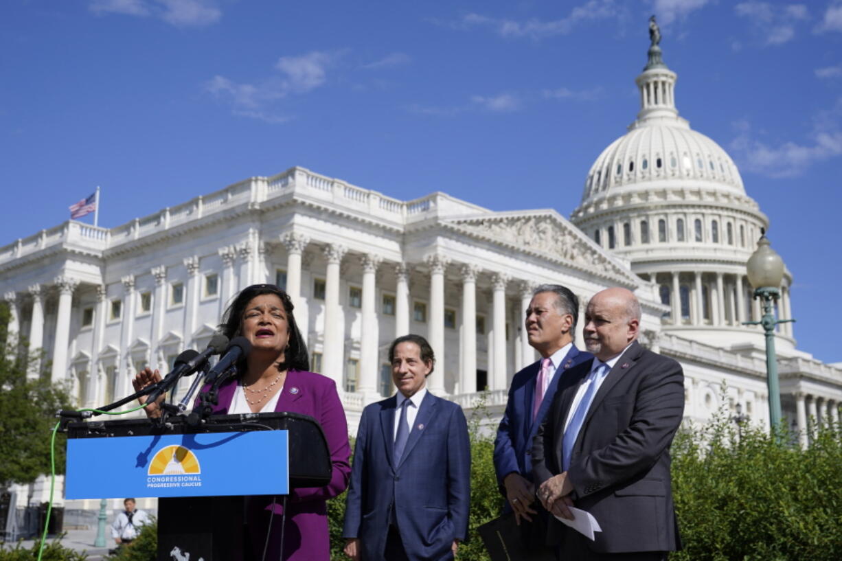 FILE - Rep. Pramila Jayapal, D-Wash., speaks at a Congressional Progressive Caucus news conference as the House meets to consider the Inflation Reduction Act, Aug. 12, 2022, on Capitol Hill in Washington. Standing with Jayapal from left are Rep. Jamie Raskin, D-Md., Rep. Mark Takano, D-Calif., and Rep. Mark Pocan, D-Wis.