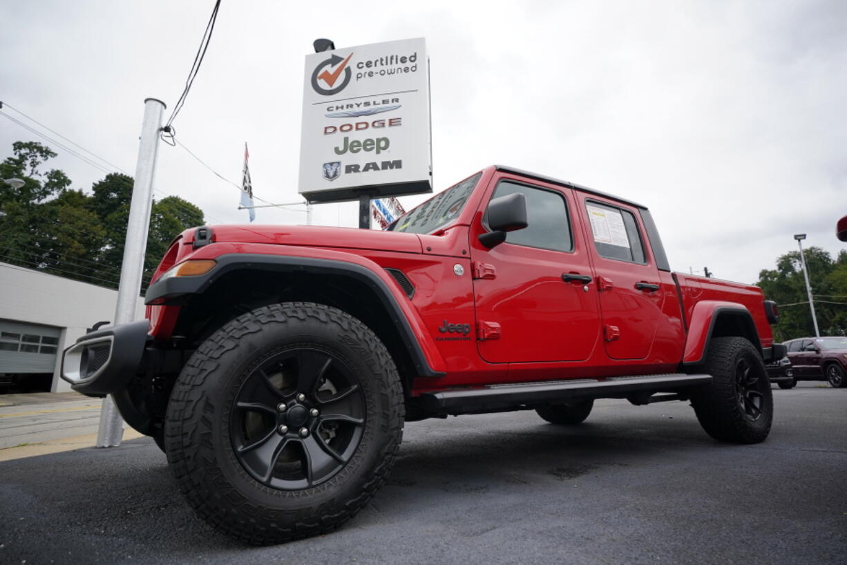 File - A used 2020 Jeep is on display on a lot in Pittsburgh, Thursday, Sept. 29, 2022. Price increases moderated in the United States last month, Thursday, Nov. 10,  in the latest sign that the inflation pressures that have gripped the nation might be easing as the economy slows and consumers grow more cautious. (AP Photo/Gene J.