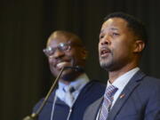 Bishop Cedrick Bridgeforth addresses delegates, guests and his new episcopal colleagues shortly after his election on Nov. 4 at Christ United Methodist Church in Salt Lake City. At left is his husband, Christopher Hucks-Ortiz.