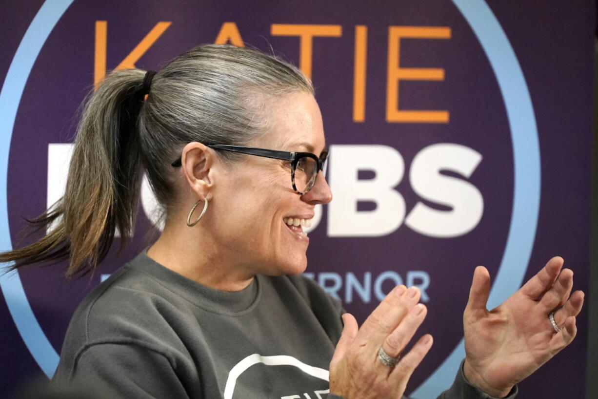 Katie Hobbs, Democratic candidate for Arizona governor, applauds supporters at a campaign event in Peoria, Ariz., Monday, Nov. 7, 2022. (AP Photo/Ross D.