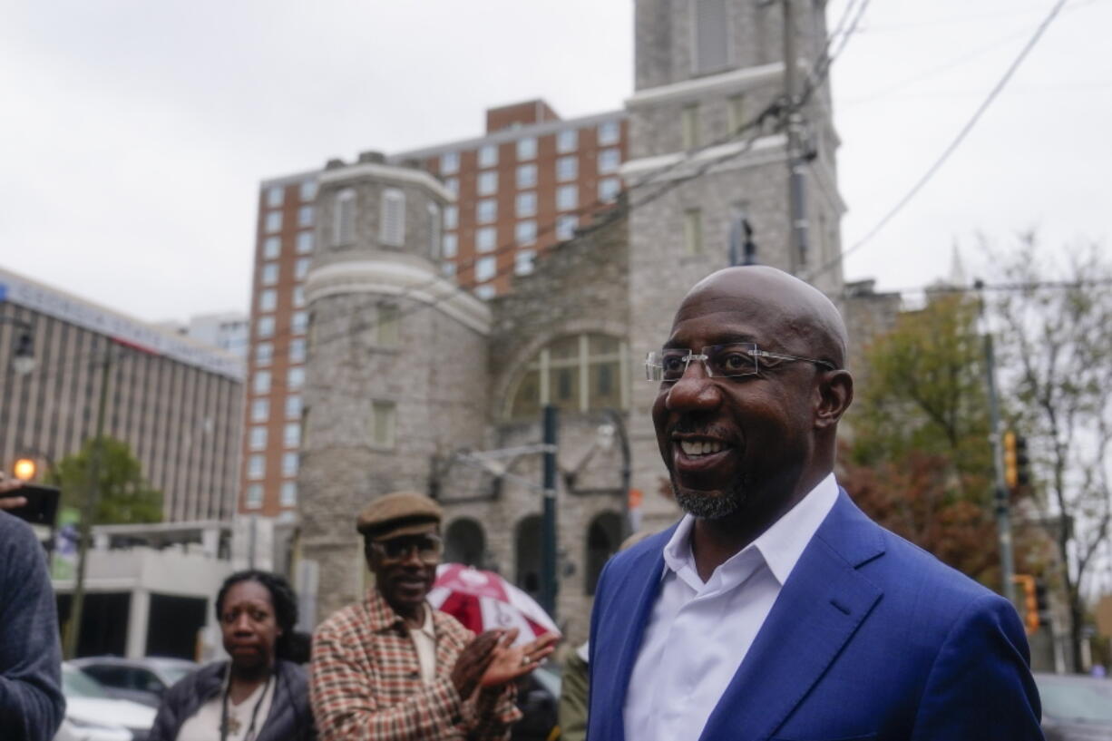 Democratic nominee for U.S. Senate Sen. Raphael Warnock arrives to speak during a news conference, Thursday, Nov. 10, 2022, in Atlanta. Warnock is running against Republican Herschel Walker in a runoff election.