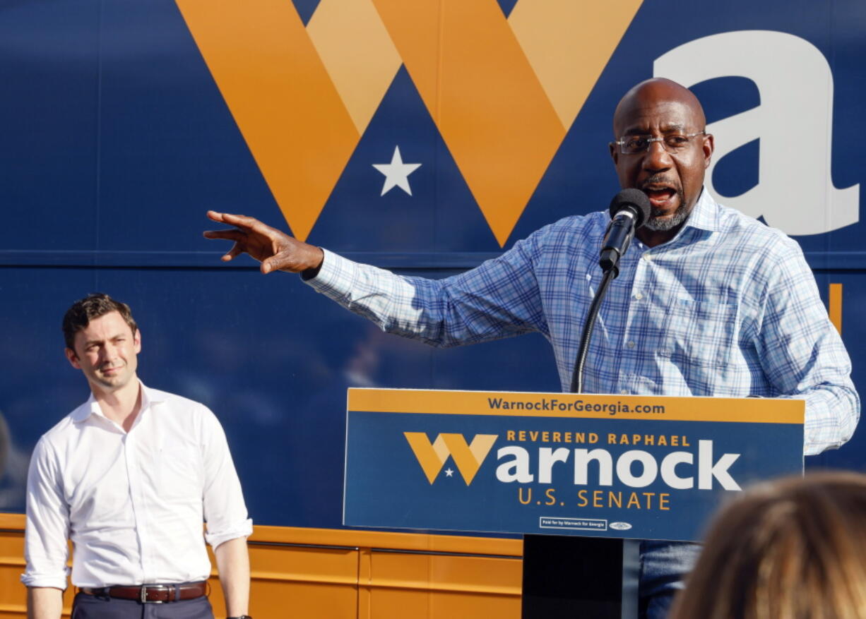 FILE - U.S. Sen. Raphael Warnock, D-Ga., speaks at a campaign event in Clarkston, Ga., on Thursday, Nov. 3, 2022. At left is U.S. Sen. Jon Ossoff, D-Ga. Herschel Walker and Sen. Raphael Warnock meet Tuesday, Nov. 8, in Georgia's Senate contest that could help determine which party controls the Senate for the next two years. More than 2.5 million Georgia voters have already cast ballots, about a 20% increase over advanced voting in 2018.